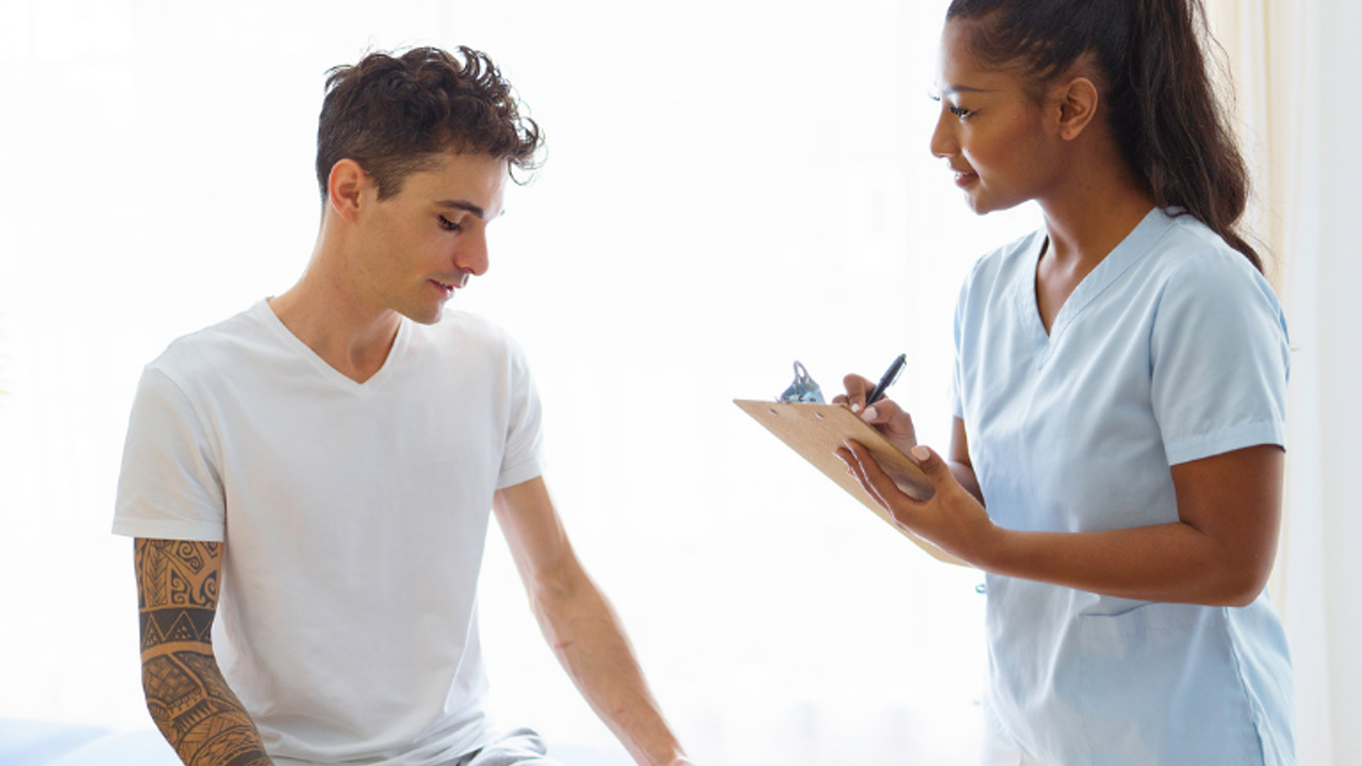 Patient relaying information to an attentive staff member.